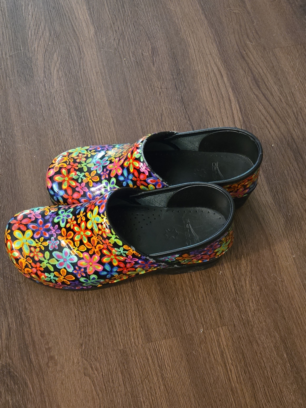 The Dansko Professional Women’s Floral Leather Clog is a stylish and comfortable